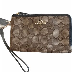 Coach wristlet: black edge double zipped brown
